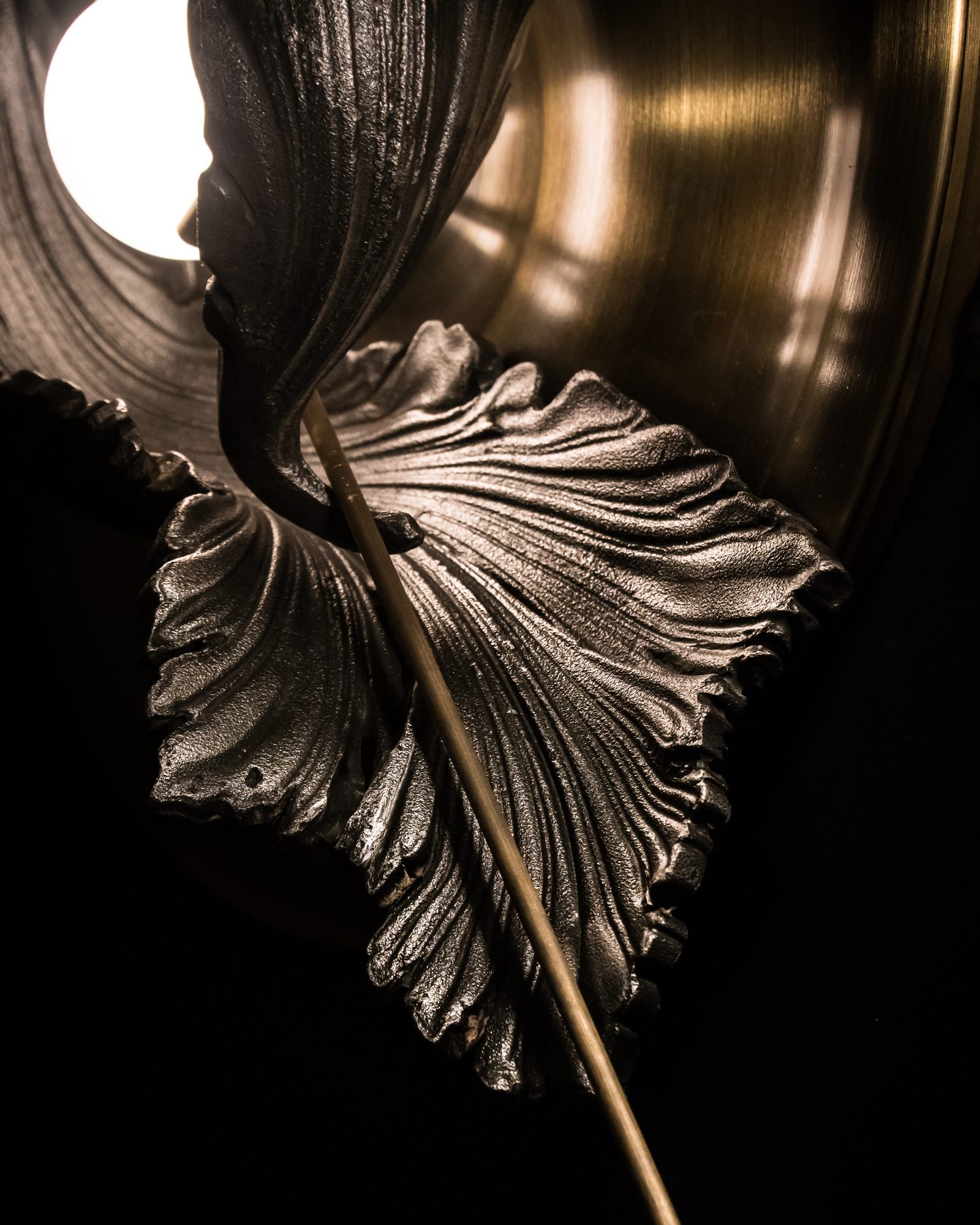 Acanthus Wall Light detail — bronze and leaf close-up