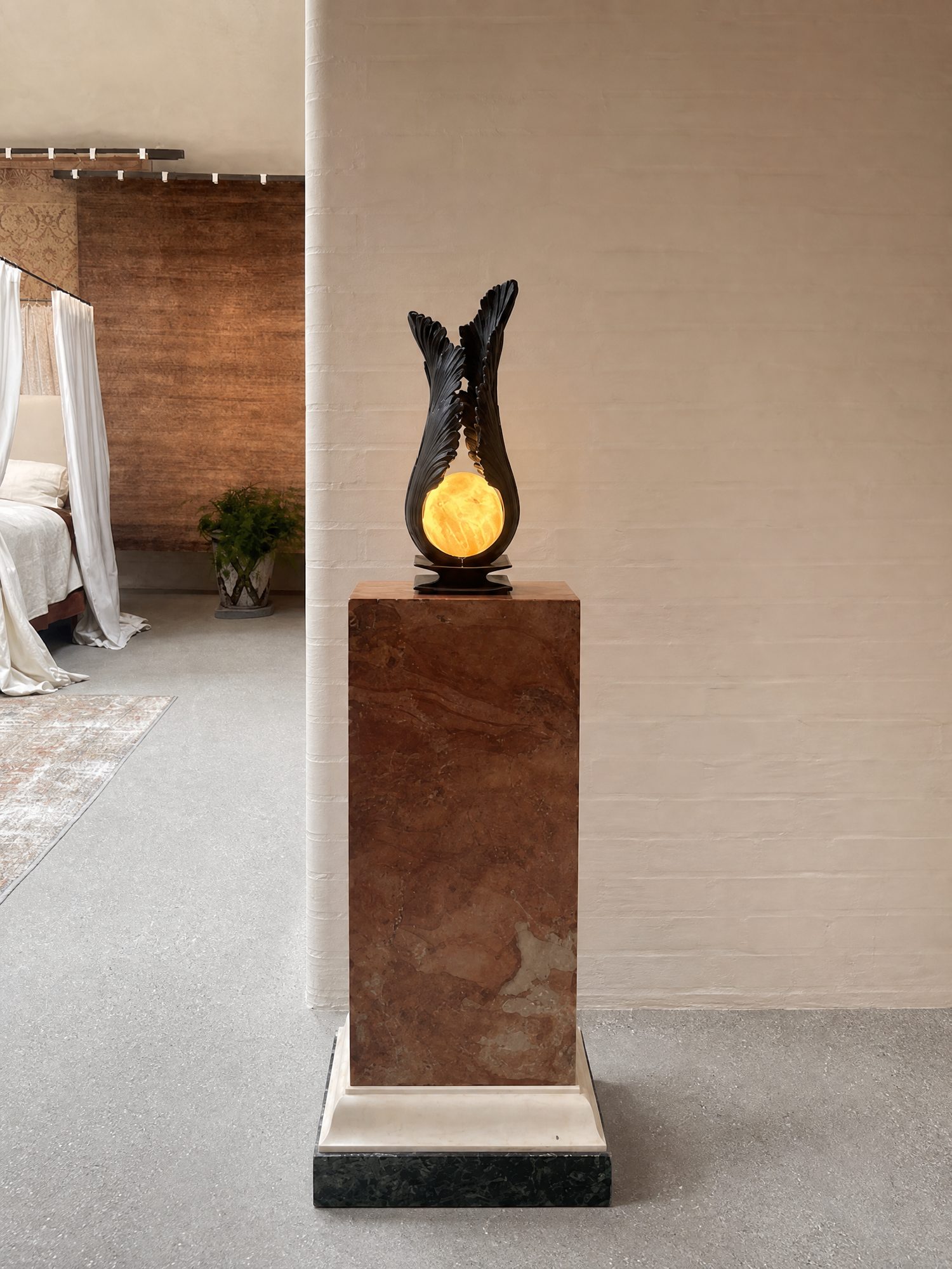 Acanthus Pedestal Light — Ignis, shown on marble plinth in interior